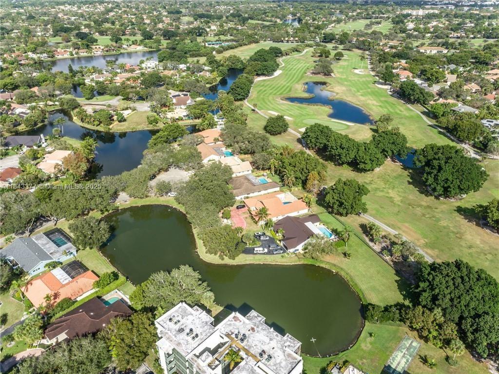 This updated 5-bedroom, 3-bath pool home offers picturesque lake views from the front and golf course views at the rear. The residence has a split floor plan, including an open living area, a separate den, family room and formal dining room. The master bedroom is located on one side of the house, while the remaining four bedrooms, including a junior master suite, are on the opposite side. The property includes a generator and is situated on approximately one-third of an acre on a quiet cul-de-sac street with lush landscaping. Hurricane Impact Windows and Doors. 2023 Re-Roof and Newer AC. This home is located near major highways and hospitals. Please note that Jacaranda Country Club Golf Course is currently under major renovations and will be closed until November 2026.
