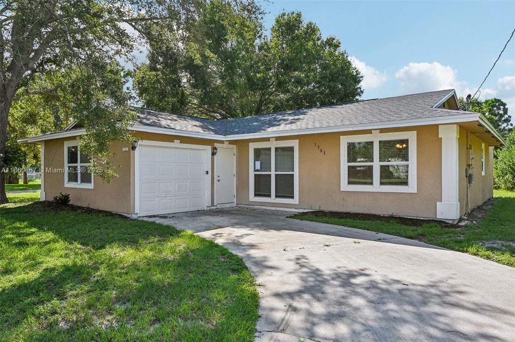 Photo of 1702 SW Boeing St, Port St Lucie, FL 34953 (MLS # A11860867)