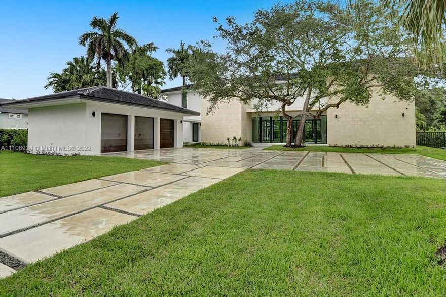 Miami Riches presents exquisite contemporary home in a vast 40,000 sf property located in prestigious northeast Pinecrest, close to Miami’s best schools. With 7,184 sf under AC and 11,651 total sf, the home showcases an impressive 22 ft high great room with 10ft high collapsable glass windows that open to perfectly integrate with its expansive backyard, pool and gazebo. Elevator ready. 7 beds, 7 baths, 2 half-baths, family room, den, covered terrace, pool/spa, gazebo, outdoor kitchen, 3 car garage, 10 ft ceilings and windows, lighting/audio/security automation. Impeccably selected designer finishes include: Italian kitchen and vanities, Subzero/Wolf appliances and Italian doors. Tennis court not included-buyer’s responsibility to confirm it can be built. Under construction. Completion 5/22