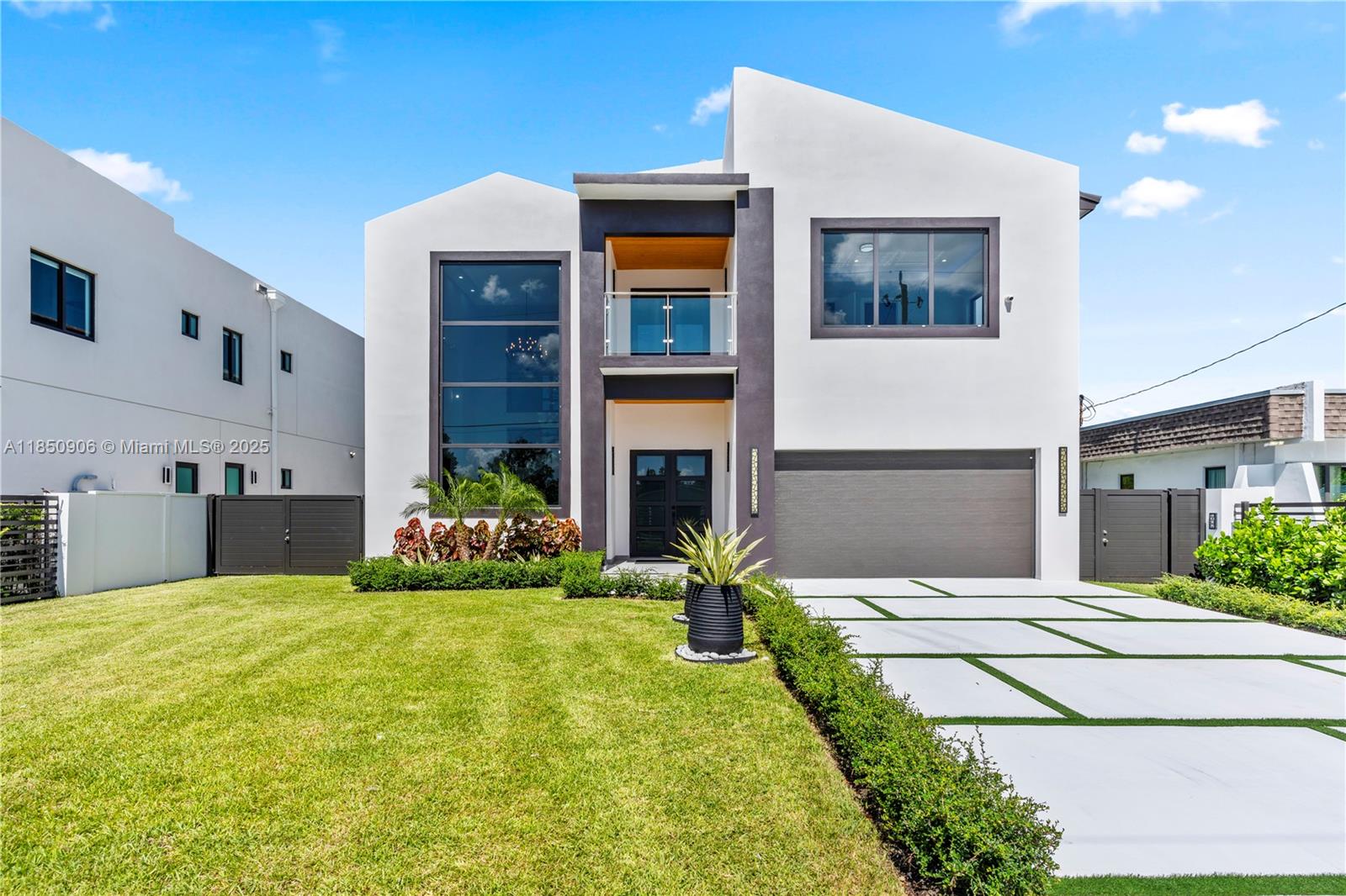 Brand-New Modern Luxury Construction within 5 miles of Coral Gables! This stunning 5,200SF residence showcases contemporary design with soaring ceilings, oversized windows, and a bright open-concept layout. The home features 4 spacious en-suite bedrooms, an additional full guest bath, and a versatile upstairs loft for office, lounge, or playroom use. The European-inspired kitchen is equipped with quartz countertops, premium stainless steel smart appliances, and custom cabinetry, seamlessly flowing into expansive living and dining spaces ideal for entertaining. The property offers privacy and security with a sleek 6-ft concrete and aluminum fence with an automatic gate. 2 car garage. One of the largest new construction homes in miami under $2.5M. Walk to Tropical Park & centrally located!