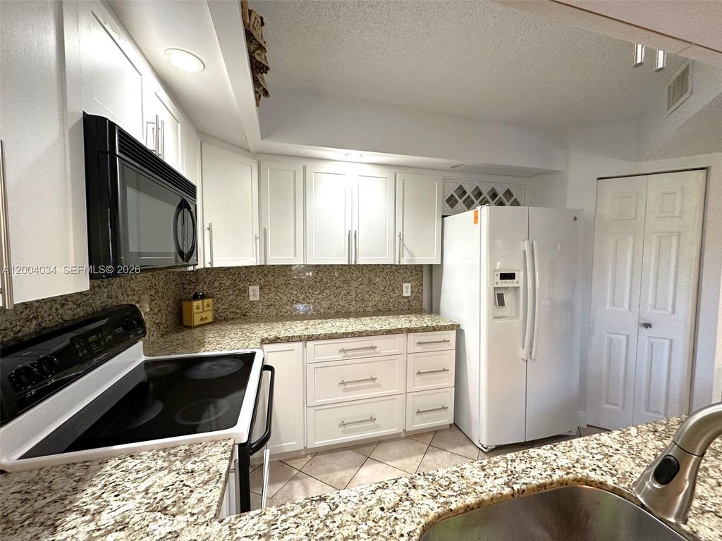 Photo of 12551 SW 16th Ct #310C, Pembroke Pines, FL 33027 (MLS # A12004034)