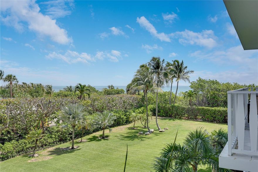 PRIVATE BEACHFRONT RETREAT
This uniquely designed apartment offers a harmonious blend of luxury & tranquility. Originally a one-bedroom, it has been thoughtfully upgraded to include an enclosed den and two full bathrooms. 
The heart & true hub of this home is an expansive open kitchen featuring an extra-large counter that invites gatherings.The low-floor setting provides serene garden views, complemented by a gentle glimpse of the ocean, infusing tranquility into your daily life. The private balcony, accessible from both the living room & bedroom, is the perfect setting for morning coffee or evening relaxation. The bedroom suite with its wide-open shower framing tropical & water views is a spa-like oasis of calm.
Effortless seaside living in full service building w/direct beach access