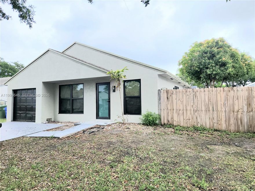 Stunning 3 bed with 2 full baths home in the heart of Pembroke Pines! Featuring a bright open layout, High vaulted Ceilings and a large backyard, new tankless hot water heater, new stainless steel stove, dishwasher and microwave. Spacious open kitchen with contemporary design. Impact windows and doors for energy efficiency. Generous bedrooms and updated bathrooms. Community offers 24 hour security, pool, tennis court and playground. Move-In- Ready...