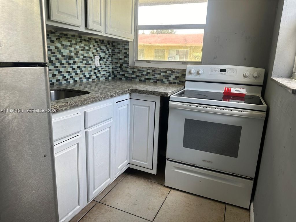 Photo of 1870 Gardenia Rd, Fort Lauderdale, FL 33317 (MLS # A11932130)