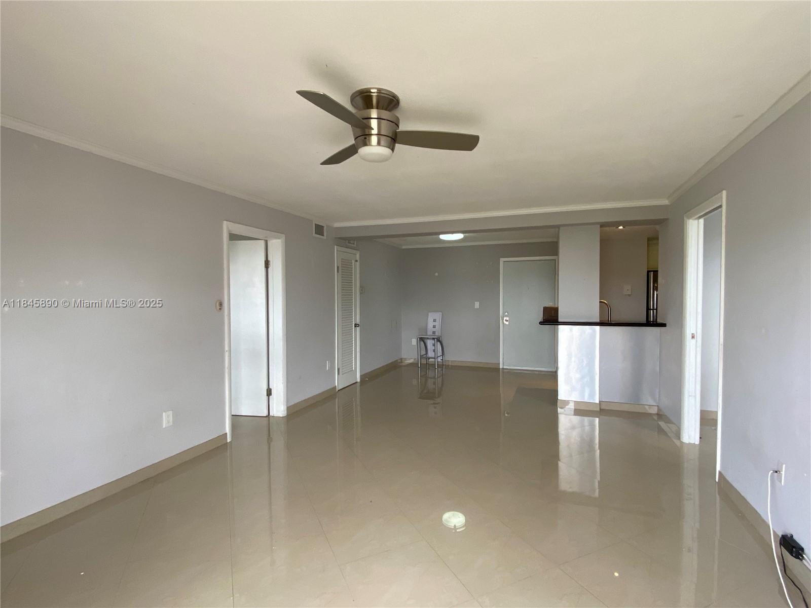 Bright and tastefully this spacious 2/2 condo offers a seamless blend of comfort and charm. The expansive living room features glossy tile floors, a modern ceiling fan, and a seamless flow into an open kitchen with granite countertops and stainless appliances. With a split floor plan, both bedrooms enjoy privacy. Step out onto the private balcony to relax with tranquil treetop views at sunset. Recently updated building upgrades include new laundry facilities, high-impact windows in the common areas, fresh hallway paint, and new carpet. Nestled just one mile from the ocean, this unit provides easy access to South Beach, North Bay Village, and Downtown Miami—all while being surrounded by picturesque low-rise landscaping and vibrant local amenities. 1 year lease minimum. No pets