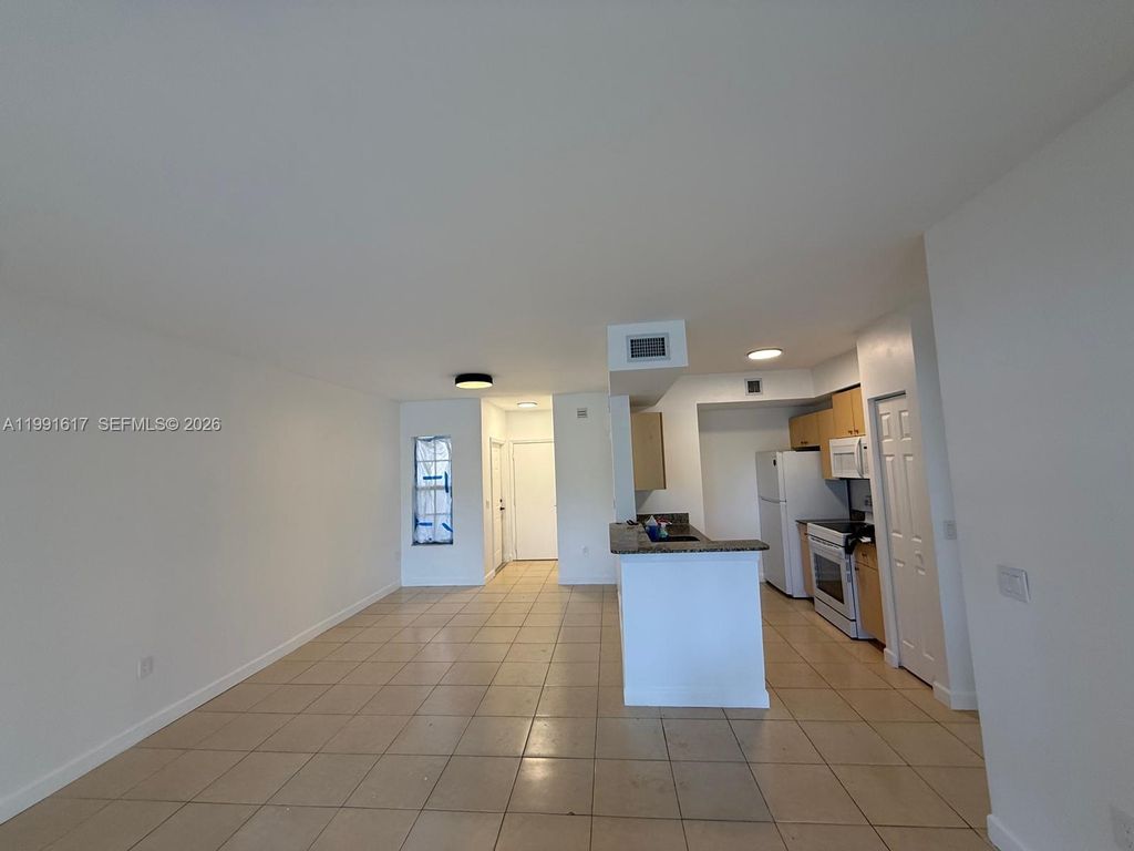 Photo of 2493 Centergate Dr #102, Miramar, FL 33025 (MLS # A11991617)