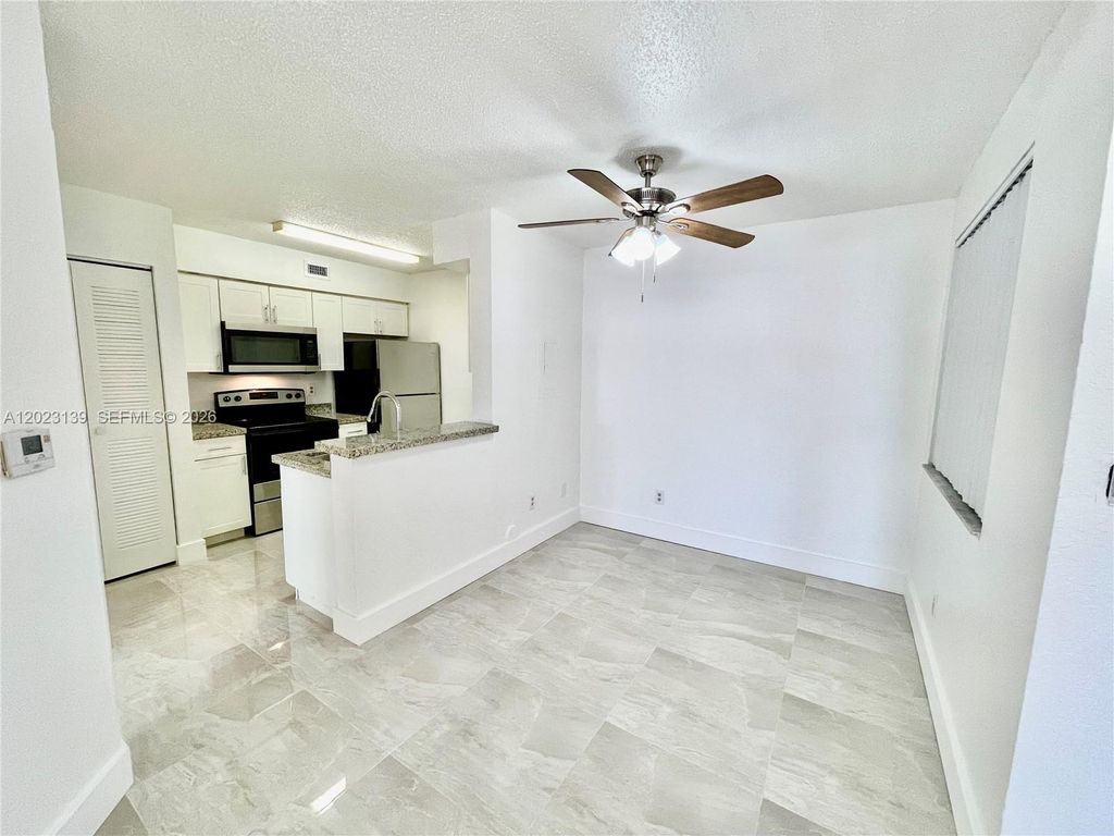Photo of 2880 N Oakland Forest Dr #103, Oakland Park, FL 33309 (MLS # A12023139)