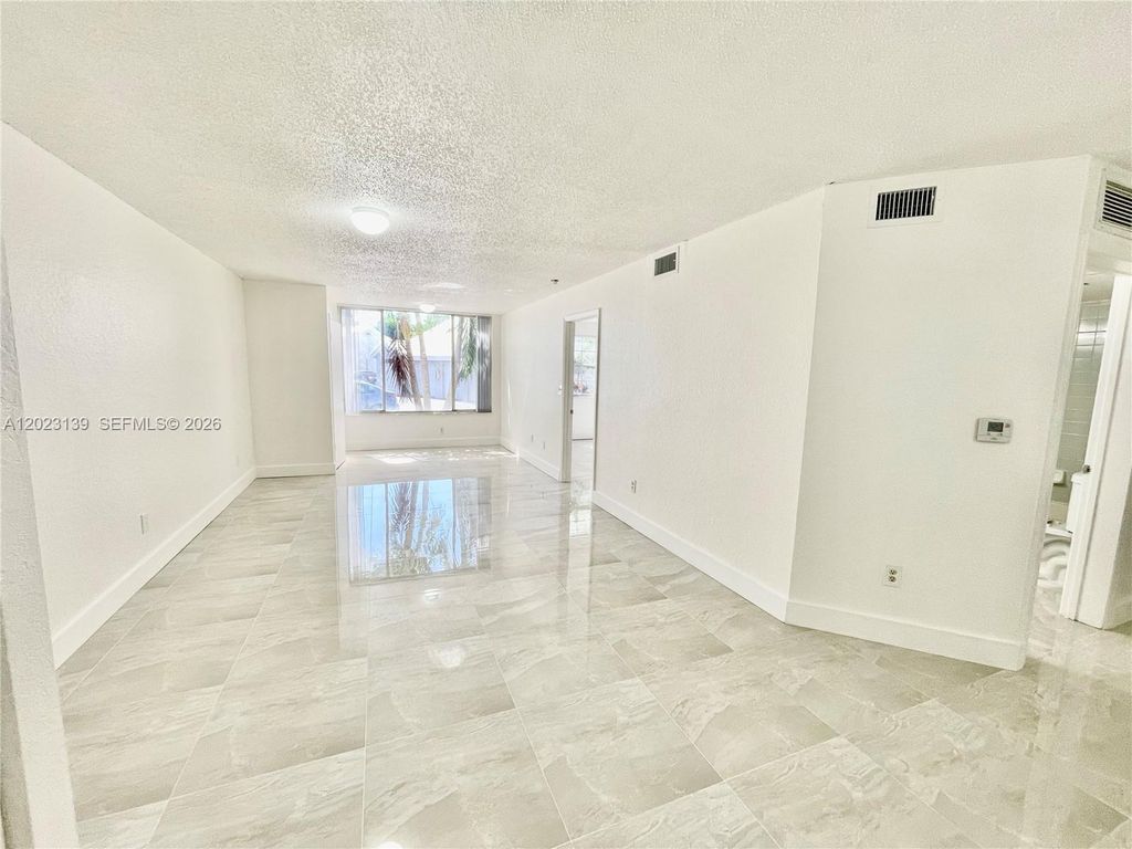 Photo of 2880 N Oakland Forest Dr #103, Oakland Park, FL 33309 (MLS # A12023139)