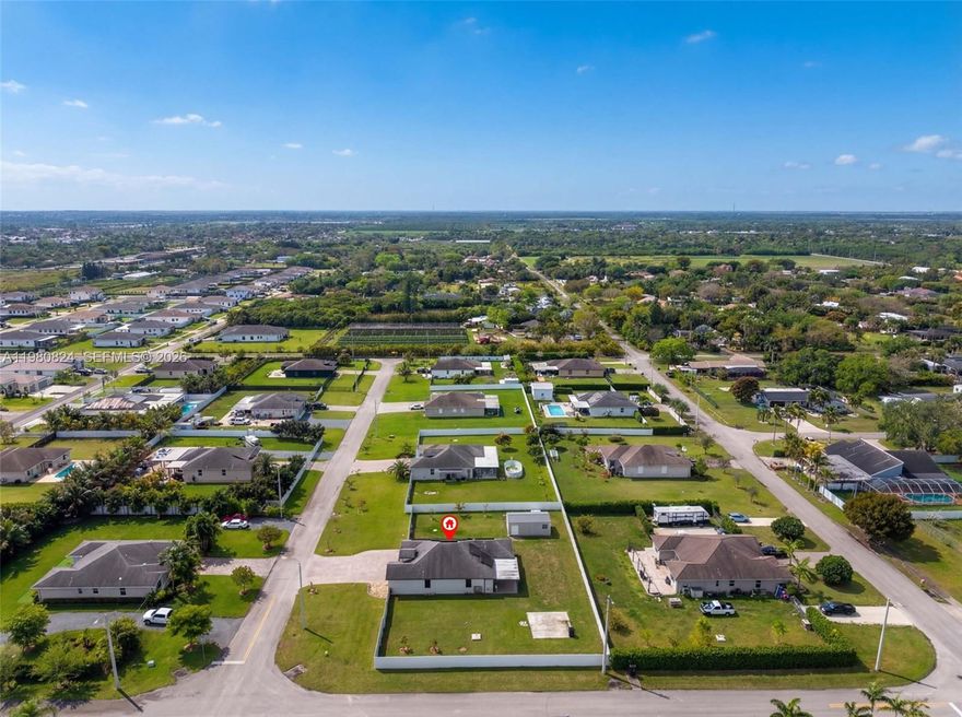 Huge Corner property , No HOa, No CDD taxes. Built in 2020,  Over 21,000 Sq. ft Lot, Newly installed Hurricane Impact windows & doors, wraparound aluminum fenced yard,  Water softener system, Security cameras & door locks. Solar panels paid off by Seller. Buyer benefits from a $15 monthly electric bill. No water/ Sewer bills. Automatic yard  irrigation system included.