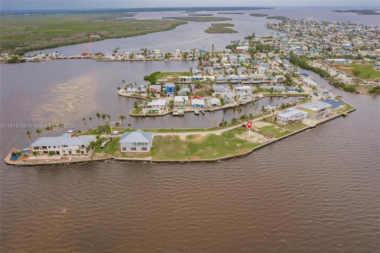 Build your dream home on this 0.15 acre cleared vacant lot of east-facing open water with 75 ft of canal frontage with a sunset view to dream of in Matlacha, FL.The property sits on a quiet cul-de-sac tucked away at the end of Matlacha Ave.The lot on the other side of the road belongs with the property with the opportunity to add a boat slip. The lot has connection to city water and sewer also internet that are ready for future use.The property is located near the public boat ramp and D&D Matlacha Bait & Tackle. Matlacha is a small, laid-back community with a population of 821 known for its world class fishing, live music, art galleries, boating, kayaking, shopping and seafood with a vibrant colorful town. This property is well suited for a primary residence or a vacation home.