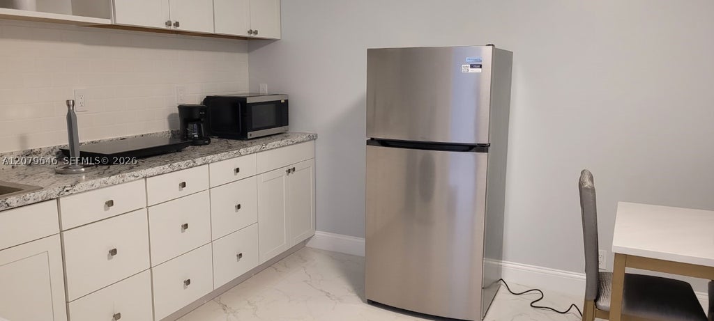 Photo of 10901 NW 6th Ct #1, Plantation, FL 33324 (MLS # A12079646)