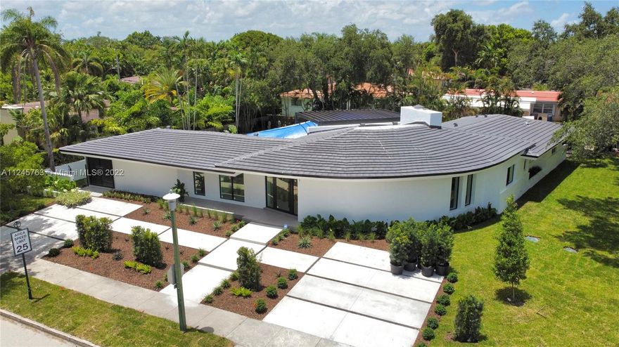 Striking Contemporary home.  This incredible property has been completely renovated from A to Z.  Every detail accounted for.  Bright and beautiful.   A one-of-a-kind home that wraps around a picturesque 20x40 pool and thoughtfully designed expansive deck.  Entertaining space inside and out.  Gated 2 vehicle carport with automatic opener and front 4 car drive way.  Please see attached list of finishes.