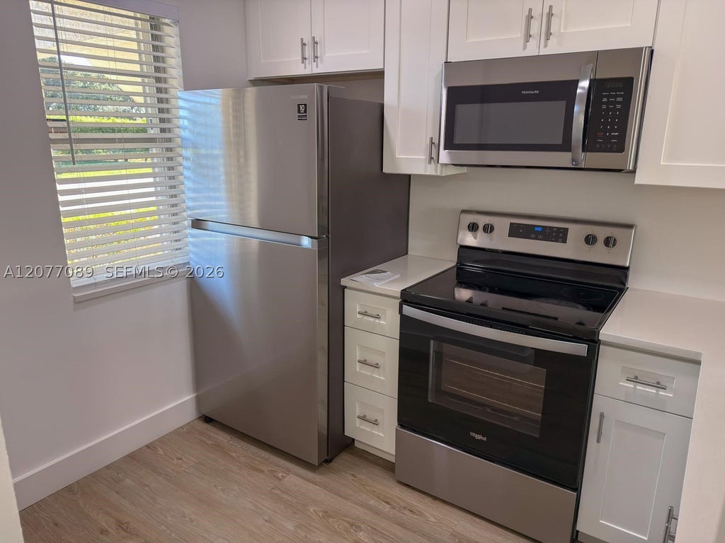 Photo of 9937 Three Lakes Cir #14d, Boca Raton, FL 33428 (MLS # A12077089)