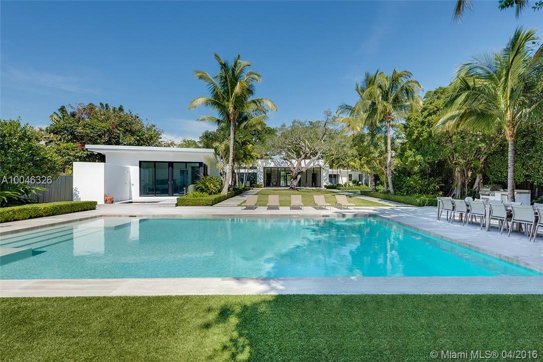 Sprawling contemporary smart home sits on an oversized corner lot surrounded by lush foliage. Completely renovated modern masterpiece feat. natural light highlighting high ceilings, lavish finishes, open spaces/views of serene, expansive outdoors. Feat: gourmet kitchen w/ Calacatta gold marble countertops, top of the line appl., expansive master suite, maids quarters, recreation room & space perfect for entertain. w/ exter. sliding pocket doors,large pool/spa,outdoor shower,BBQ, 60 SF WF & private dock