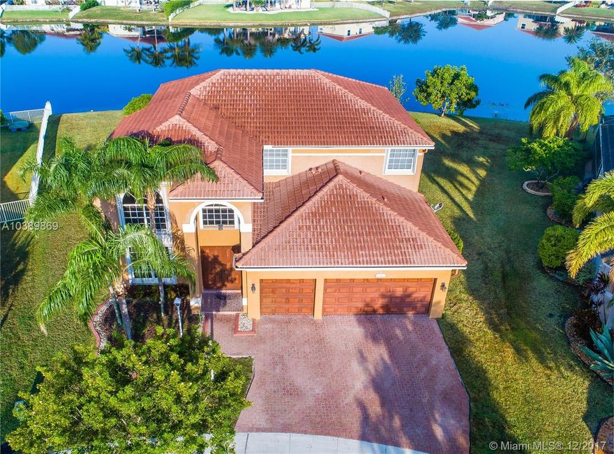 OUTSTANDING "KINGSTON" MODEL IN SOUGHT AFTER PEMBROKE FALLS ** PERFECTLY SITUATED ON AN OVER 16,000 SF LAKE FRONT LOT ** SCREENED-IN COVERED PATIO WITH OVERSIZED POOL ** FEATURING 4 BEDROOMS, 3 1/2 BATHROOMS AND HUGE LOFT WITH OVER 400 SF ** UPGRADED KITCHEN WITH STAINLESS STEEL APPLIANCES & WOOD CABINETS ** ACCORDION HURRICANE SHUTTERS ** RARE FIND, CONTACT US TODAY TO SCHEDULE A PRIVATE VIEWING **