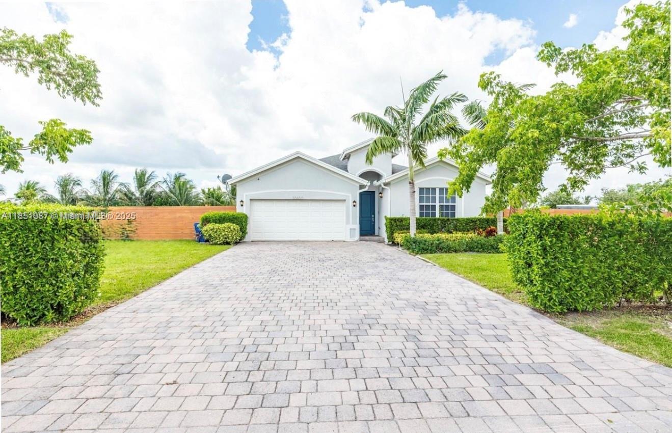 BEAUTIFUL HOUSE WITHOUT HOA!!! Nestled in a peaceful area just west of Homestead, this stunning 4-bedroom, 2-bathroom home offers the perfect blend of comfort and functionality. Designed with easy living in mind, the home features tile flooring throughout and a desirable split-bedroom layout for added privacy. The large, modern kitchen boasts sleek quartz countertops, ample cabinetry, and a spacious pantry—ideal for both everyday use and entertaining.Offer must include credit report and income verification.We Present All Offers "The lease excludes both side yards, but the property offers a spacious and functional main yard."