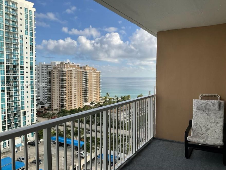 Beautiful ocean view studio with a large terrace offering peaceful water views day and night. Move-in ready for vacation or full time living. Features a custom-built closet with bed and a linen/utility closet. Unit includes 1 assigned parking space. Maintenance covers WiFi, cable, A/C, water, parking, security, and reserves. The building offers resort-style amenities including beach service, 2 pools, 2 restaurants with full bars, 2 gyms, tennis, pickleball, BBQ area, boat docks, salon, convenience stores, courtesy bus, billiards, card room, basketball, shuffleboard, golf putting area, classes, activities, and more—all in a prime location across from the beach.