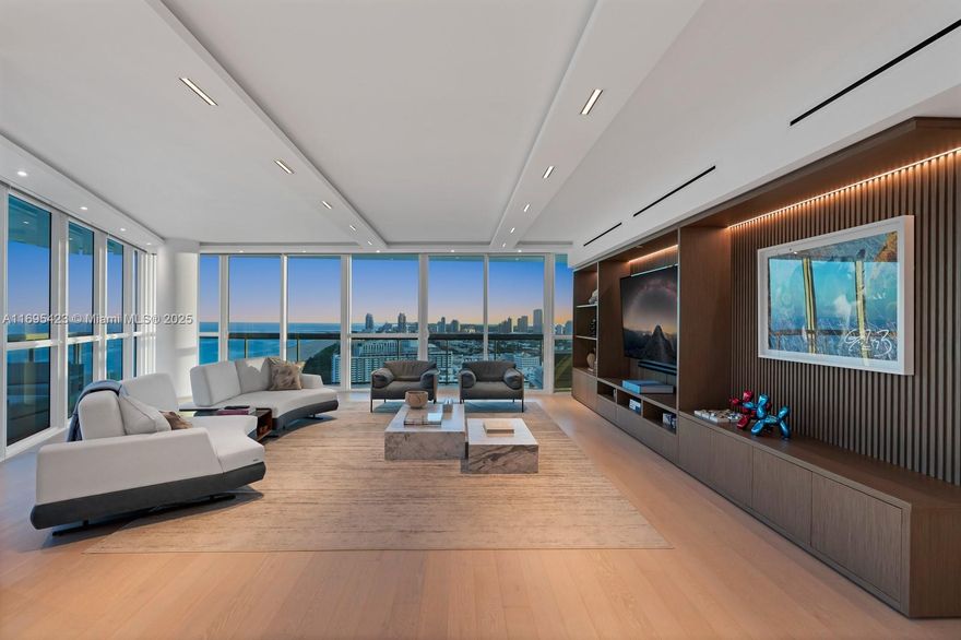 Step Inside With Me! This iconic Setai Skyhome unveils to a 63’ oceanfront main salon with stunning sitting room and TV lounges. Spanning over 6,000 SF, this 4-unit combination floorplan represents the 2nd largest residence in the building where every social area & bedroom offers endless views. The custom reconfiguration includes white oak floors, sleek modern kitchen, tray ceilings, wood paneled millwork, Lutron automation, and marble baths with heated floors. Entertain in style at 2 bar settings and a world class oceanfront 3-row theater. Epic downtown skyline vistas and sunsets are afforded to the dining & family rooms as well as glass encased study/5th sleeping quarter. In the heart of Billionaires Beach, the 5 star Setai offers 3 restaurants, known spa & beach for celebrity sightings.