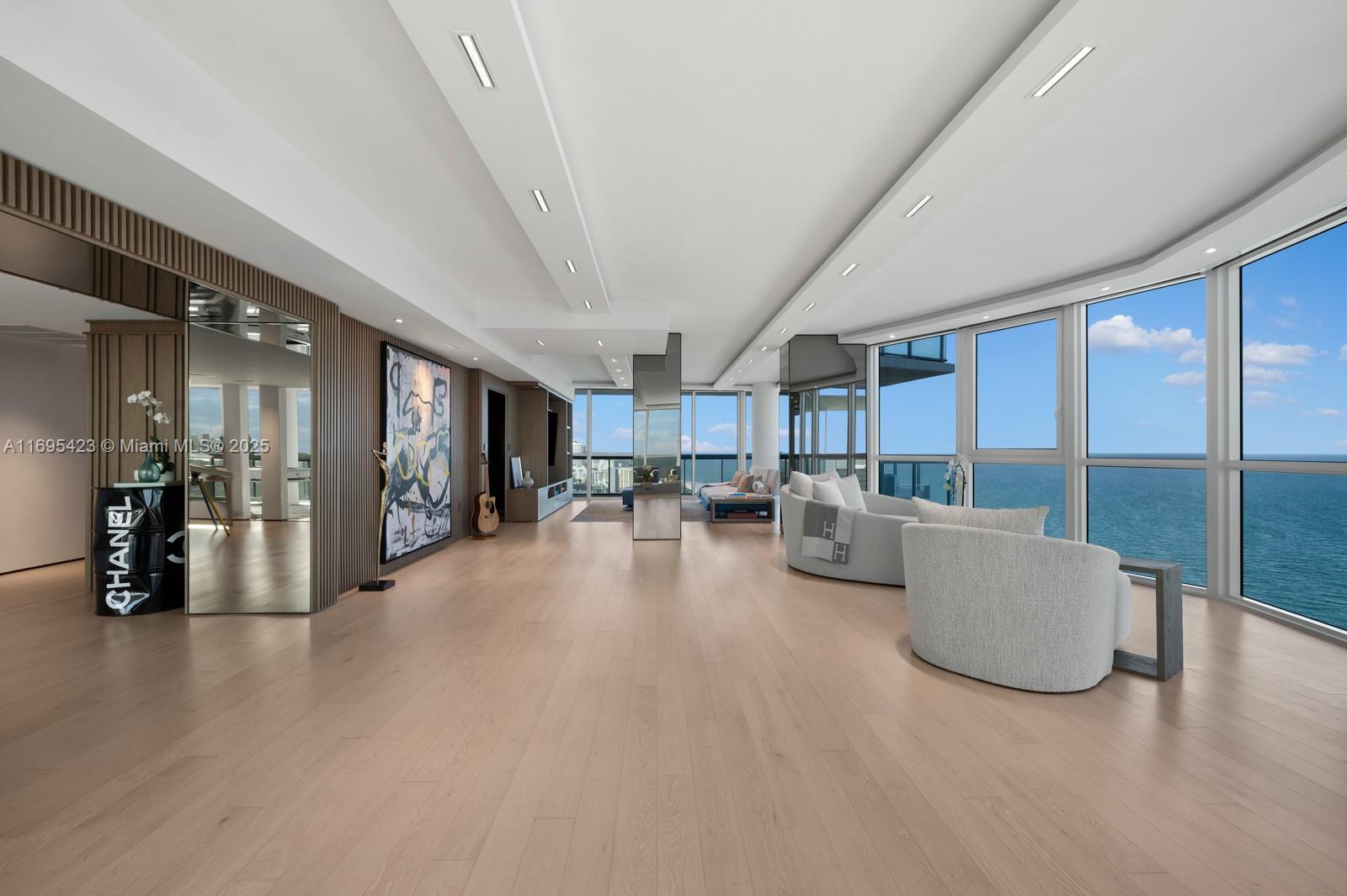 Step Inside With Me! This iconic Setai Skyhome unveils to a 63’ oceanfront main salon with stunning sitting room and TV lounges. Spanning over 6,000 SF, this 4-unit combination floorplan represents the 2nd largest residence in the building where every social area & bedroom offers endless views. The custom reconfiguration includes white oak floors, sleek modern kitchen, tray ceilings, wood paneled millwork, Lutron automation, and marble baths with heated floors. Entertain in style at 2 bar settings and a world class oceanfront 3-row theater. Epic downtown skyline vistas and sunsets are afforded to the dining & family rooms as well as glass encased study/5th sleeping quarter. In the heart of Billionaires Beach, the 5 star Setai offers 3 restaurants, known spa & beach for celebrity sightings.