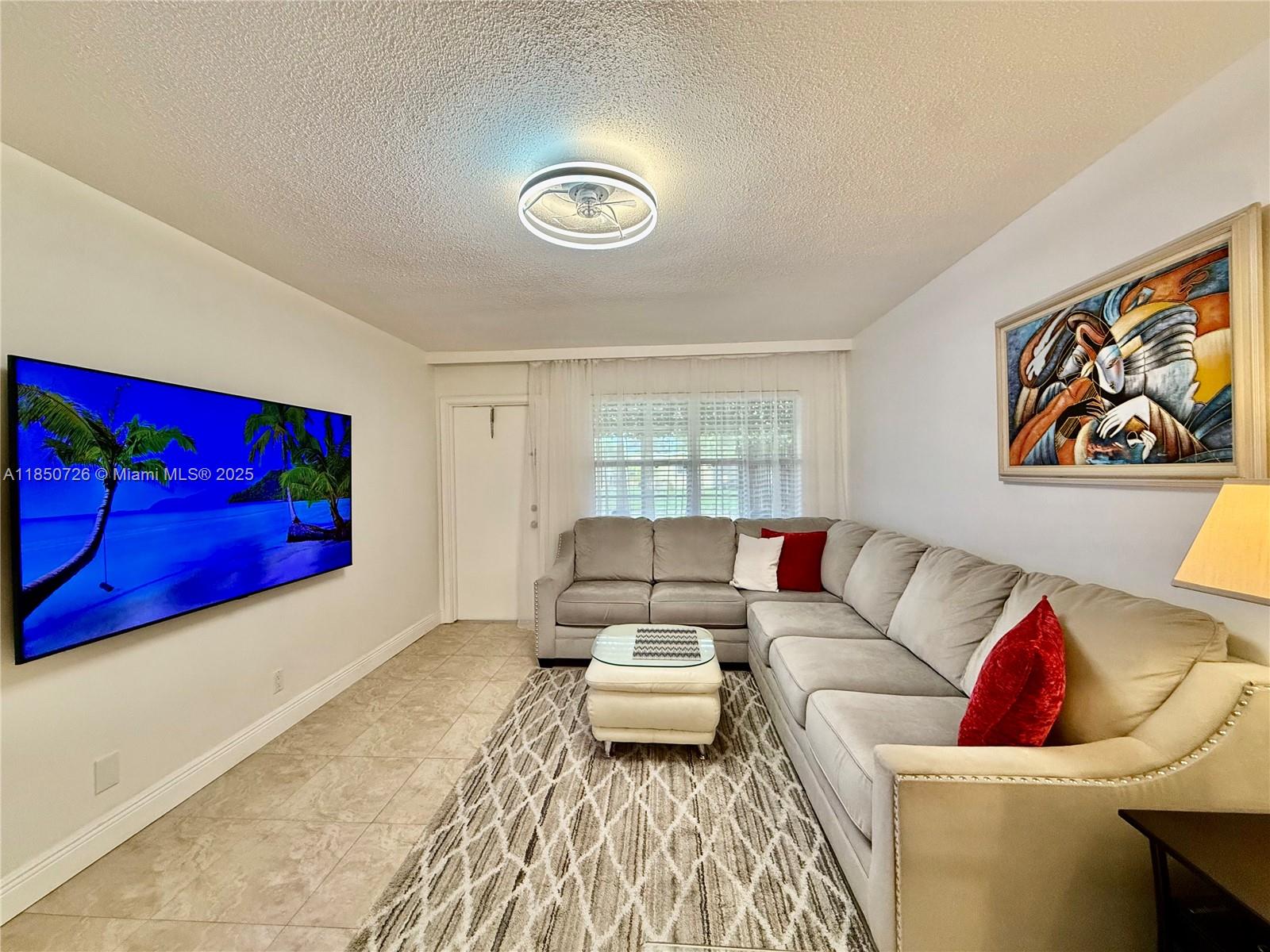 This charming 1 Bed 1 Bath Unit on the 1st floor is now available For Sale in 45+ community. It features a screened balcony, in-unit Washer and Dryer, and 1 assigned parking conveniently located right in front of your door. The property is situated in a safe, up-and-coming neighborhood in Lauderhill, just minutes from I-95, the Turnpike, grocery stores, banks, schools, and colleges. With a minimum age requirement of 45yo to purchase and shockingly low HOA fees, this is an excellent opportunity to live in a well-connected and vibrant area that can rent after 2 years owned. Seller is Motivated! And will sell fully furnished as-is at full asking price! Contact me for Showing Now! Vacant and Easy to Show!