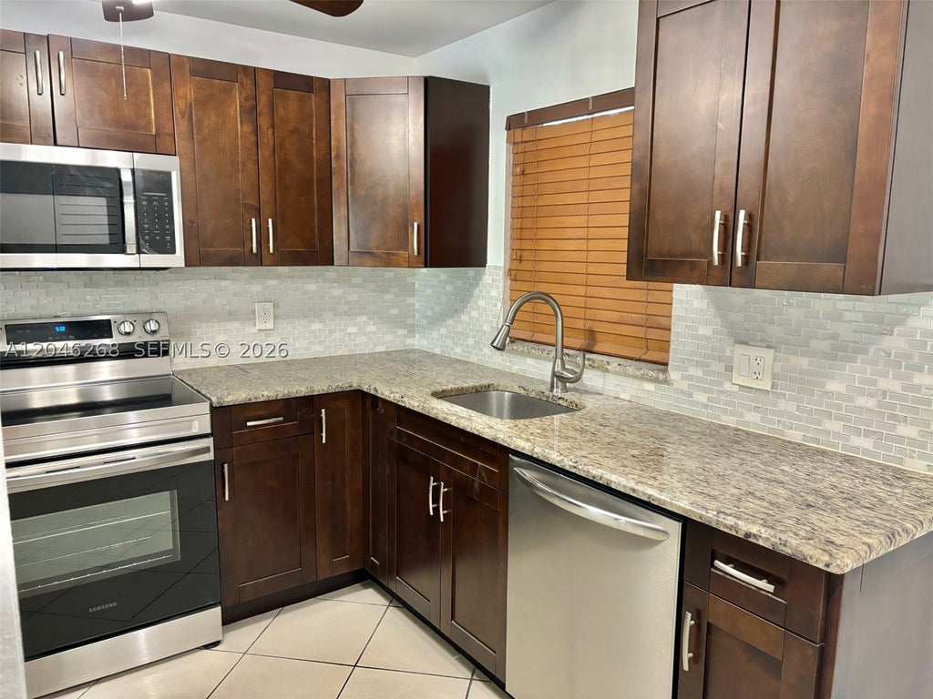Photo of 9411 Evergreen Pl #303, Davie, FL 33324 (MLS # A12046268)