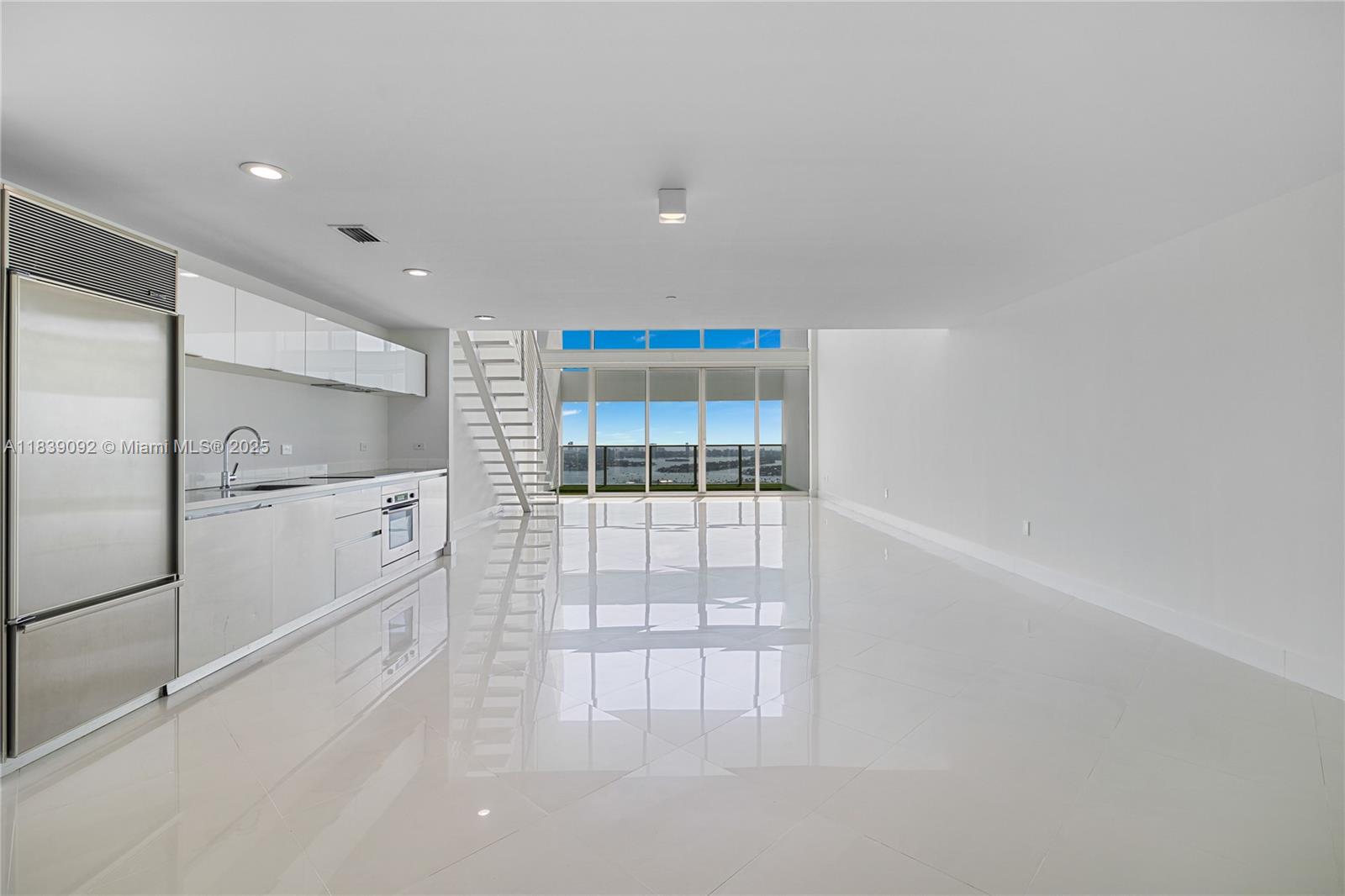 Mesmerizing views await you, from this virtually staged, 2 Bd/2.5 Ba 03 line at T.M.P.. This 1,794 S.F. loft is the highest level below the PH's, boasting a 10x20 terrace with views of the ocean, bay and the Miami Beach and Miami skyline. Finished with neutral porcelain flooring throughout with an updated kitchen with Bosch and Meile appliances as well as and updated master bathroom with new vanity, shower and more. Live in the cultural hub of the city with Museum Park, Frost Science Museum and the P.A.M. right outside your front door. T.M.P. is a full-service boutique luxury tower with only 200 units housing the Clinique La Prairie Spa with 5 dipping pools, full gym and cardio theater, 24 Security and Concierge and more.