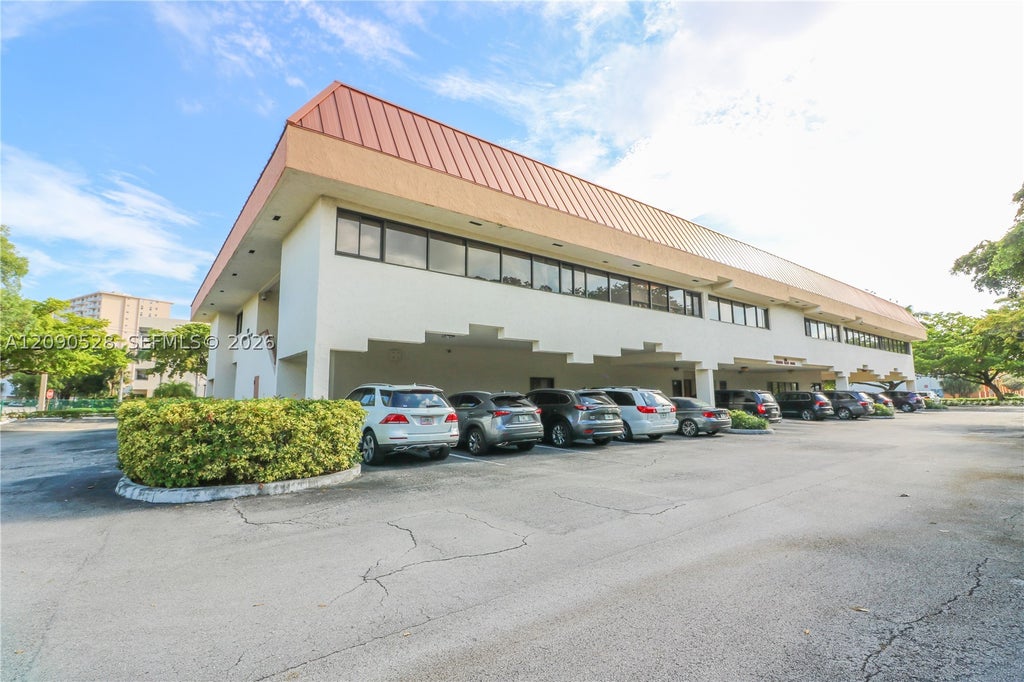 Photo of 501 Golden Isles Dr #201-C, Hallandale Beach, FL 33009 (MLS # A12090528)