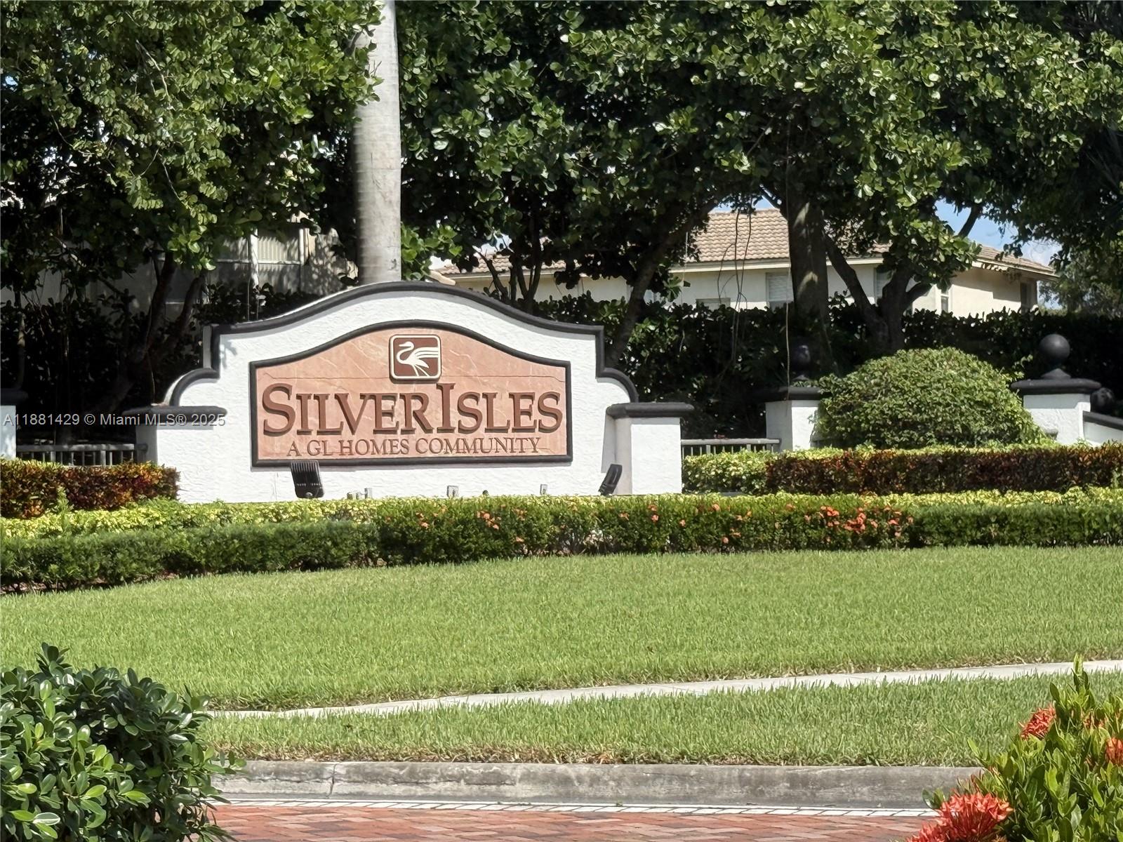 Stunning 2 story home on wide lake w/5 beds, 3 baths, in the gated community of Silver ISLES! This home features tile flooring throughout. There is enough room for everyone. Two huge walk-in closets. One bed and full bath on lower level. The spacious gourmet kitchen is complete w/ granite countertops, stainless steel appliances & center island. The backyard is a perfect place to entertain outside tile patio, iron fence with protective screen overlooking the wide lake, no neighbors behind! This home is protected by accordion shutters, upgraded kitchen, 2year new water heater, upgrade bathrooms, his/her bathroom sink, and jacuzzi tub ! Other features include: granite bathroom sinks, glass staircase, and 2 car garage with TELSA electric pump!