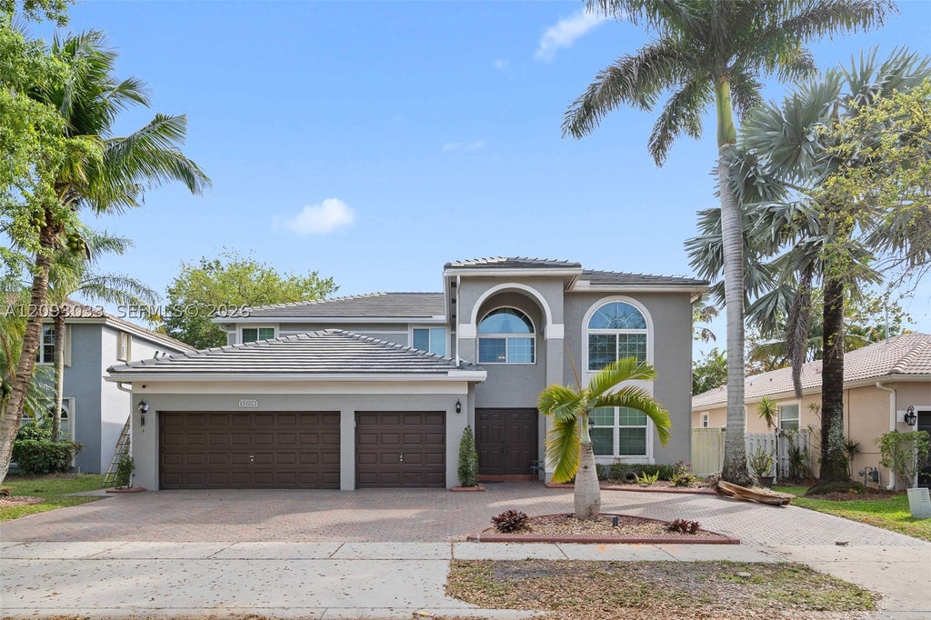 Photo of 12724 NW 18th Ct, Pembroke Pines, FL 33028 (MLS # A12093033)