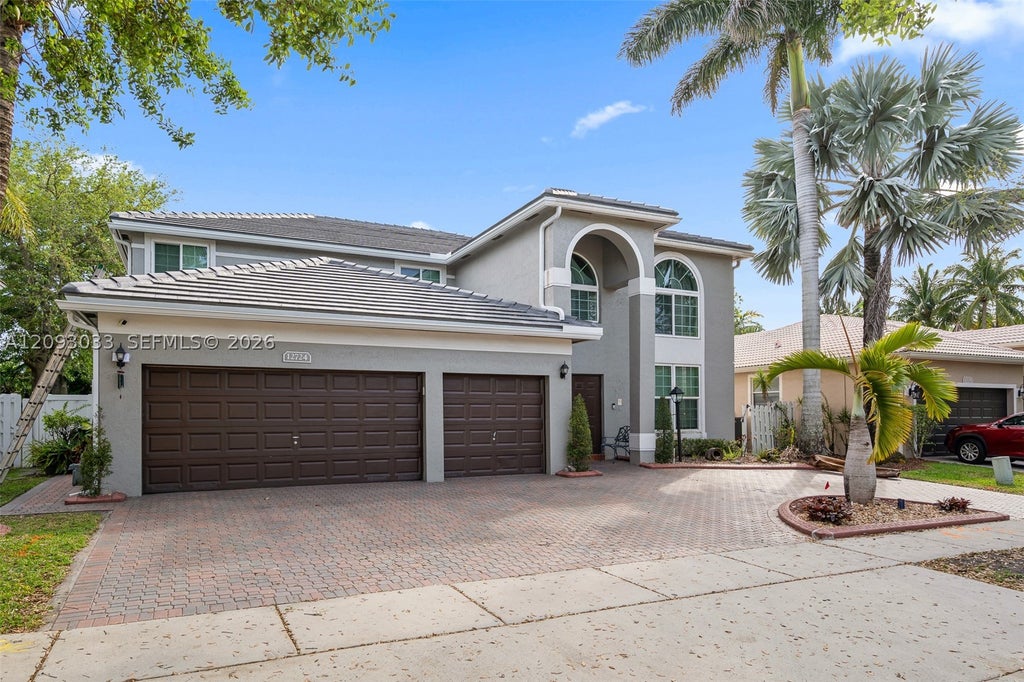 Photo of 12724 NW 18th Ct, Pembroke Pines, FL 33028 (MLS # A12093033)