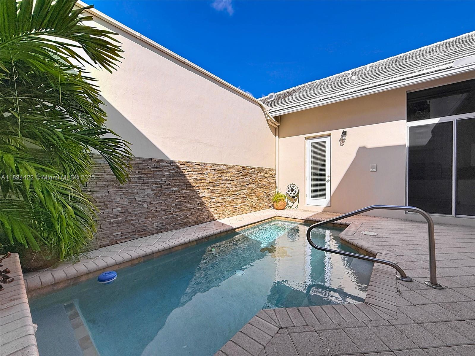 Charming and the largest available courtyard townhome with a private pool in the exclusive Boca Golf & Tennis Club! This property boasts a 2-story main house (3-bed/3-bath) and a guest house (1-bed/1-bath). Offering 2089 ft² of living space, with a total of 2788 ft² when including the garage and screened terrace. The bright interior features an open floor plan, with a kitchen equipped with s/s appliances and granite countertops. The social area overlooks the private pool. Updates include a partially replaced roof, some impact windows, a new A/C and pool water heater. Bermuda Village at BG&TC is a gated community with golf, tennis, and more. Conveniently located near shopping, beaches, and highways. No mandatory membership is required to enjoy this country club lifestyle!