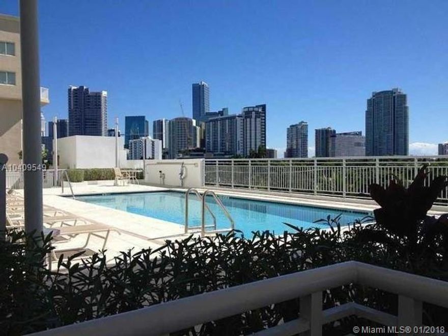 Beautiful quiet desirable neighborhood of The Roads. Walking distance to Brickell, modern condo with pool and gym. Washer and dryer in unit, wrap around balcony, tile floor throughout, beautiful view of The Roads and Brickell. Swimming pool and gym.