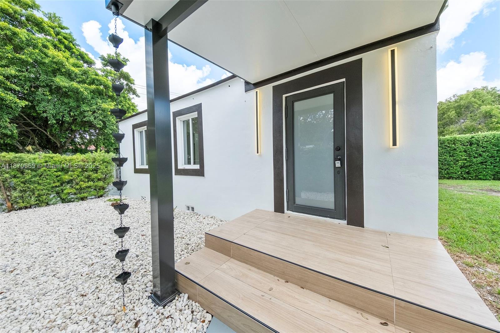 Stunning fully renovated corner lot home in the heart of Coral Gables, Lush landscaping creates a private oasis. Roof in excellent condition, brand new AC, and fully fenced for privacy and security. All doors and windows are high-impact hurricane resistant. Features a modern terrace with great lighting, perfect for family gatherings. Stylish exterior with updated finishes throughout. Ideally located within walking distance to top-rated elementary and middle schools. Just 10 minutes from Brickell, 10 minutes from the beach, and 5 minutes from Miami International Airport. A move-in ready home offering comfort, charm, and convenience.