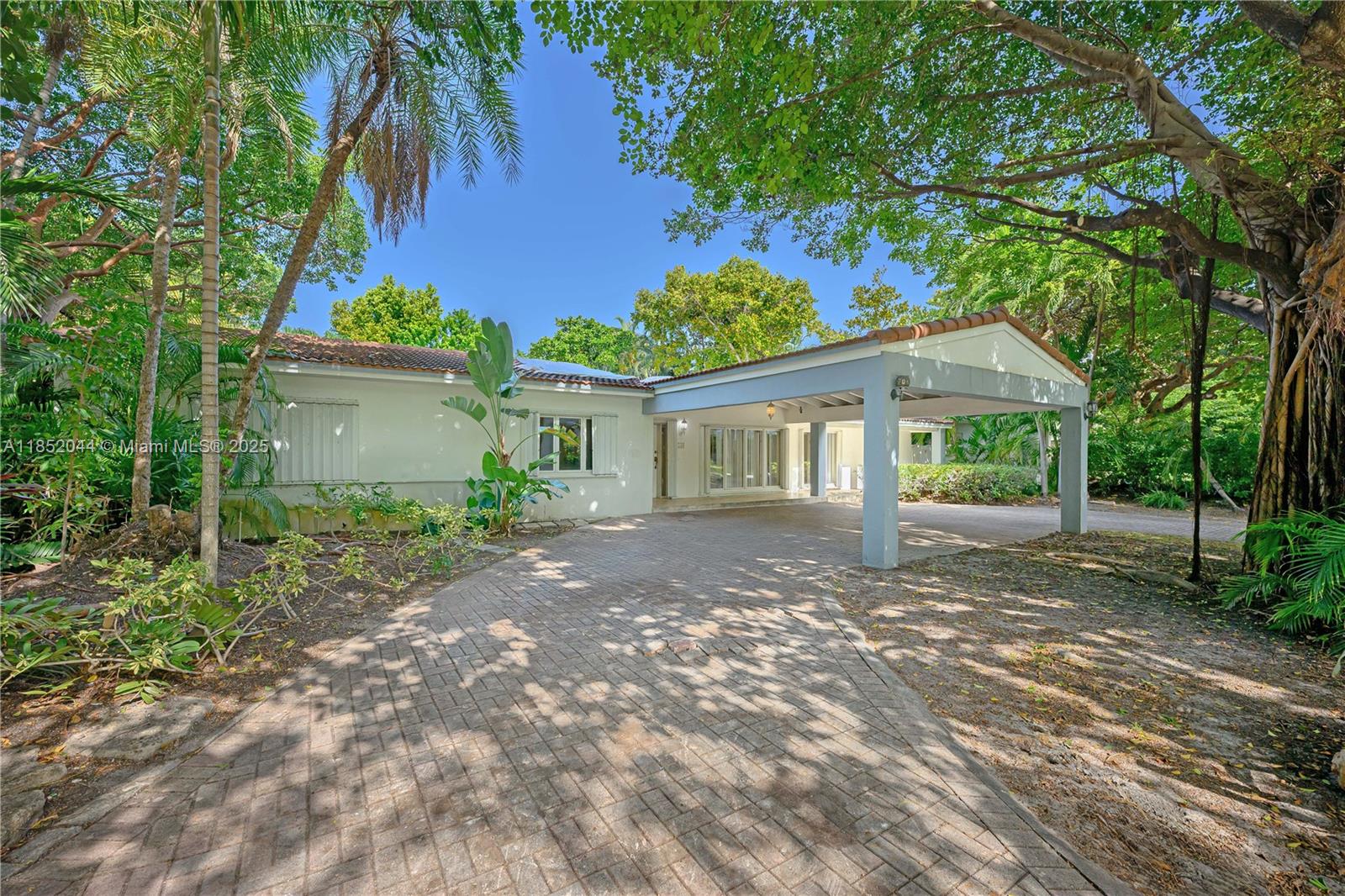Rare opportunity in the sought-after Holiday Colony subdivision of Key Biscayne! Just steps from the beach, 330 Pacific Rd offers a prime location with few homes available in this exclusive area. Renovate the existing home or build your dream residence on this desirable lot. The spacious layout features ample natural light from large windows and doors opening to the screened pool area. Enjoy the convenience of a circular driveway with porte-cochere. A true island gem with endless potential!