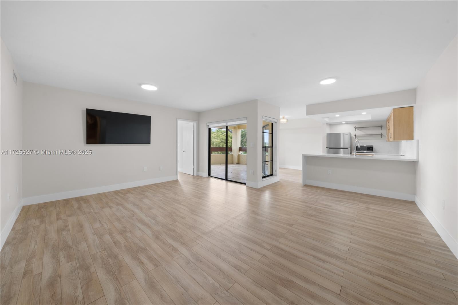 Spacious and remodeled 2-bedroom, 2-bathroom apartment in the desirable Kenland Bend North community. Located on the fourth floor of a gated community with 24/7 security, the unit features walk-in closets, an oversized balcony, and a washer and dryer inside. The building includes an elevator for convenience. Amenities offer a pool, clubhouse, tennis courts, and racquetball courts. Conveniently situated minutes from the Turnpike, with easy access to major shopping, restaurants, Baptist Hospital, MDC College, and FIU, all within 20 minutes.