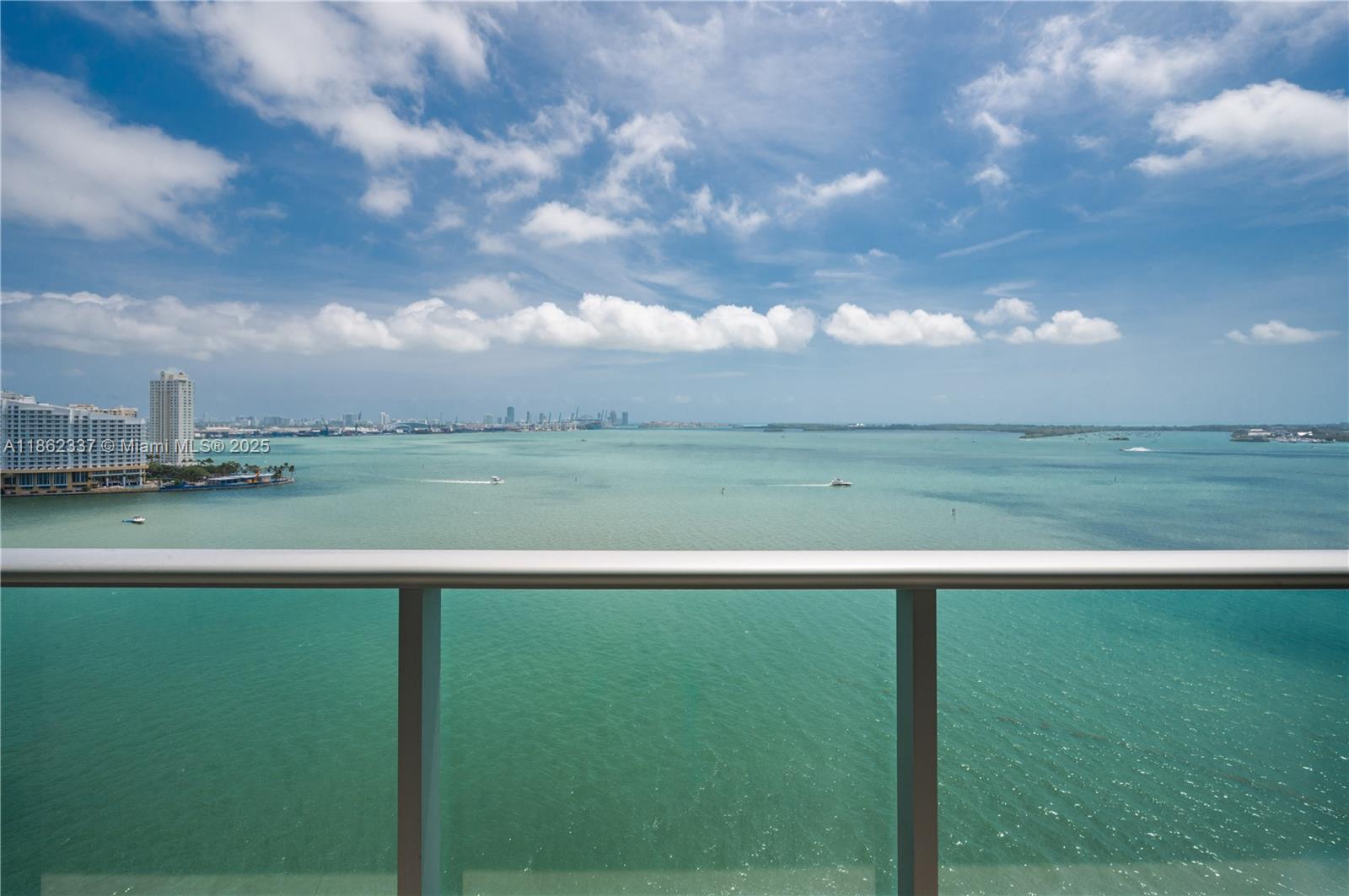 Experience bespoke living at Jade Residences Brickell 1801, a turnkey corner residence with direct bay views and an expansive balcony. A private elevator opens to a 2-bed/2.5-bath home with floor-to-ceiling windows, modern organic design, and curated interiors featuring natural walnut dining and living pieces, SubZero & Miele kitchen, Samsung 77” TV with Focal speakers and Arcam amp, dining for eight, premium mattresses, and 525-thread count linens. Bi-weekly cleaning adds ease. World-class amenities include an infinity-edge pool, spa, fitness, rooftop sky lounge, racquetball, concierge, valet & more—steps from Brickell’s premier dining and nightlife.