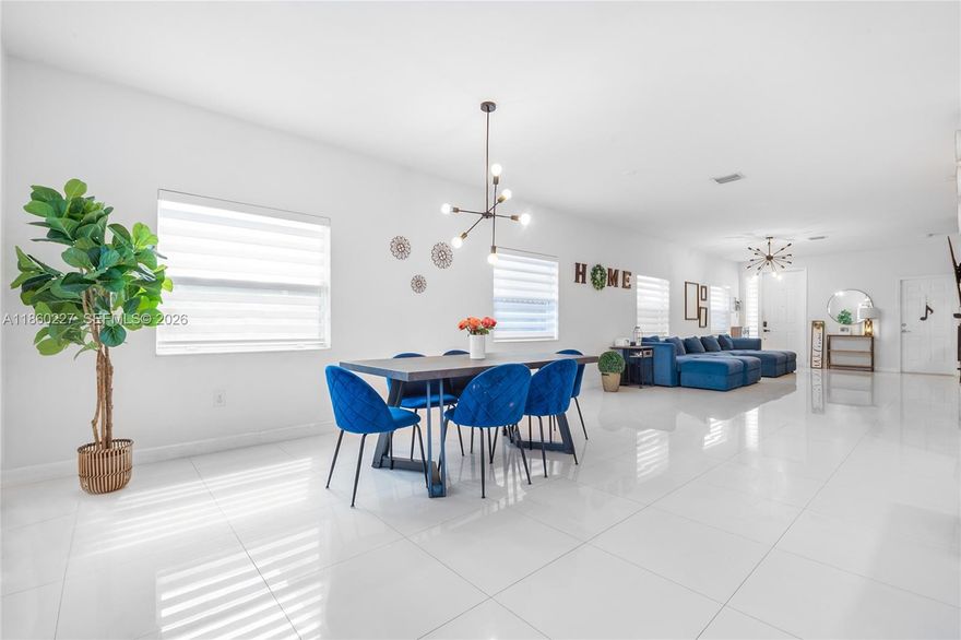 Stunning 5-bedroom, 3-bathroom home in Homestead featuring gleaming porcelain flooring throughout and a spacious open-concept layout. Enjoy the convenience of a first-floor bedroom with a full bathroom—perfect for guests or multigenerational living. The luxurious master suite upstairs boasts a private en-suite with a walk-in shower and royal soaking tub. Ideal for entertaining and family living, this home combines style, comfort, and functionality in one beautiful package! *Owner includes a 1 year American Shield home warranty for added peace of mind.*