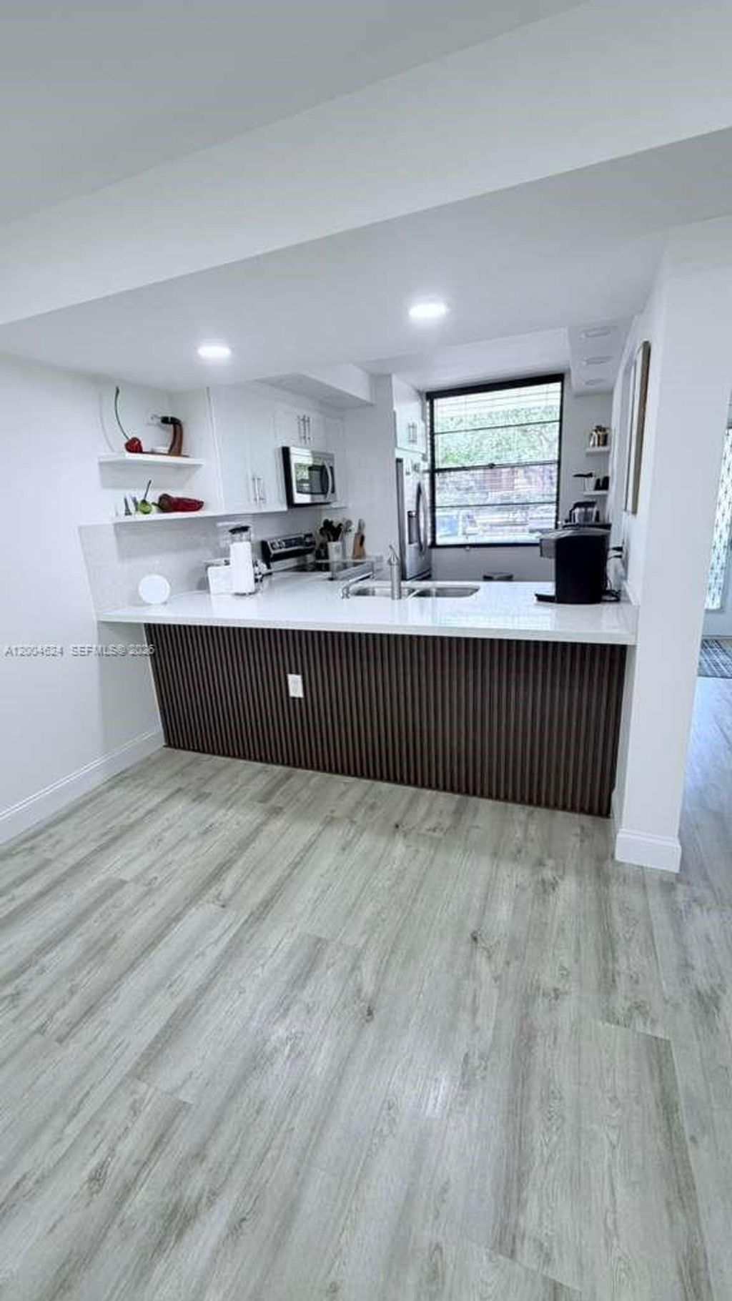 Photo of 1721 Whitehall Dr #101, Davie, FL 33324 (MLS # A12004624)