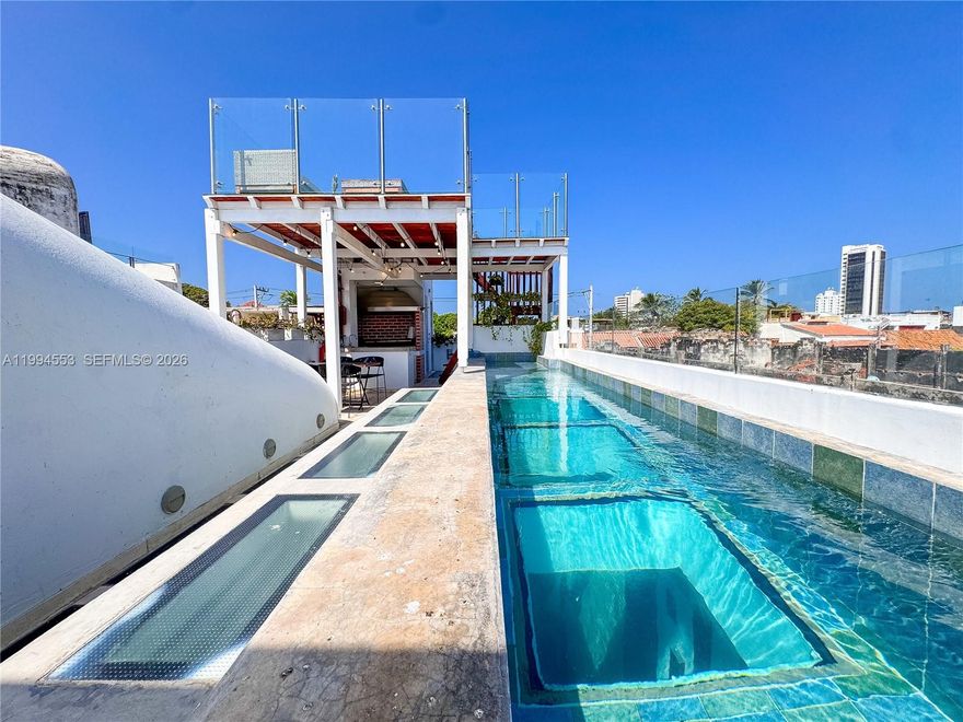 Strategic property located in the iconic neighborhood of Getsemaní, Cartagena, directly facing the walled city along the renowned Calle del Pedregal, in the heart of the historic center. This real estate asset represents a unique investment opportunity in one of the most solid tourism markets in Latin America, combining strong appreciation potential, historical exclusivity, and excellent income potential. The property features a lot size of 88 m² and a total built area of 281 m² plus a 22 m² loft lookout, distributed across multiple levels with a private rooftop, glass-style pool, jacuzzi, BBQ area, and social spaces offering open views of Castillo de San Felipe, Cerro de La Popa, and Cartagena Bay. Its layout includes 3 bedrooms, spacious living areas, a fully equipped kitchen, and air conditioning throughout, making it ideal for premium short-term rental operations with high international demand. The lot-to-construction ratio maximizes land use within the historic district, while its prime location ensures strong occupancy, high ADR (average daily rate), and attractive cash flow. This is a turnkey asset, perfect for international investors, luxury short-term rental operators, or boutique real estate portfolios seeking a blend of personal use and financial return in a high-end experiential segment.