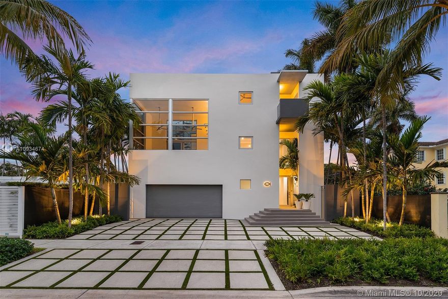 Welcome to a fully remodeled 6,870 total sf modern Coconut Grove waterfront haven of clean lines, open spaces, and abundant light from impact windows and doors. This engaging three-story 4BR/5+1BA home includes an elevator and 4 car temperature-controlled garage. A remarkable wet bar and game room on the ground level opens to a pool deck and reveals 50' of waterfront on a protected inlet with no bridges to Biscayne Bay. The second floor features a gourmet kitchen with Wolf and Subzero appliances, and an impressive 300 bottle glass wine cellar. The living, dining, and family rooms open up to a central court yard, circulating Bay breezes, and a spiral staircase leading to magnificent views from a rooftop sundeck. All four bedrooms each of them with en-suite bathrooms are on the third floor.