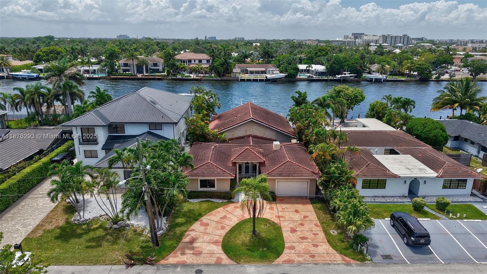This turkey sanctuary about 80 feet on the intracoastal, with 17,000 lb lift and direct ocean access. Three Private en Suite bedrooms offer comfort for both residents and guest, while soaring vaulted ceilings and a chefs designer kitchen, with double ovens creates an inviting centerpiece for entertaining. The open living space flows seamlessly to your outdoor retreat, where a sparkly pool, dockside mornings, and golden sunset vies awaits, just steps form the beach, this residneces blneds effortless elegance with the eae of everyday coastal living.