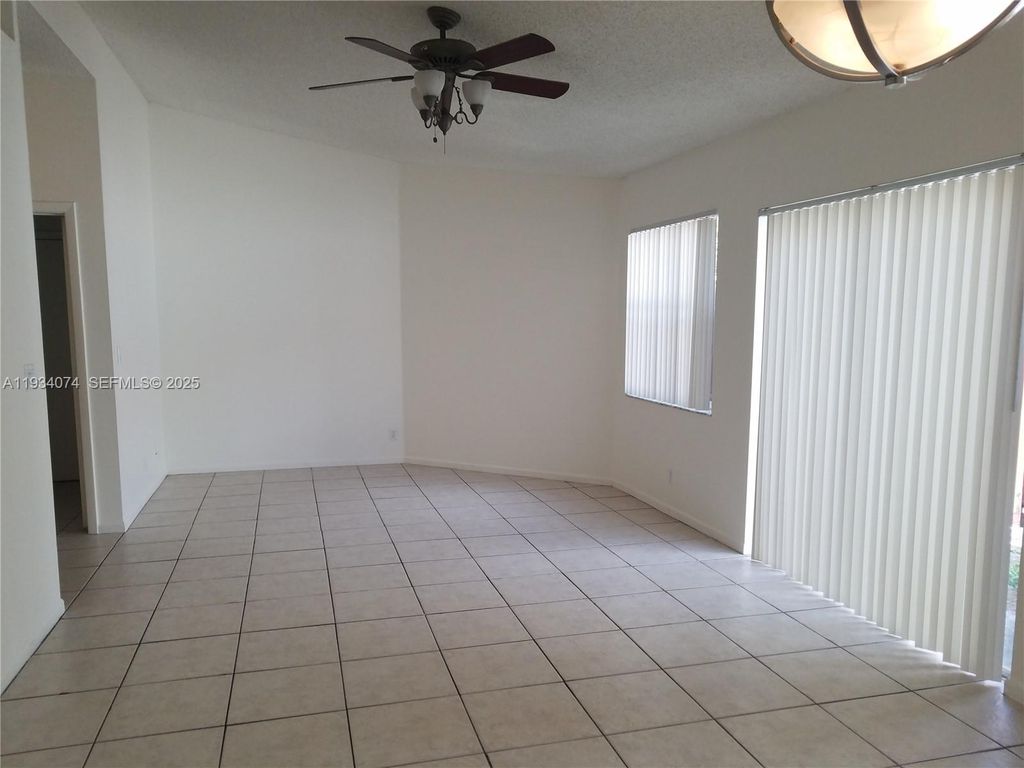 Photo of 4779 NW 5th Ct, Coconut Creek, FL 33063 (MLS # A11934074)
