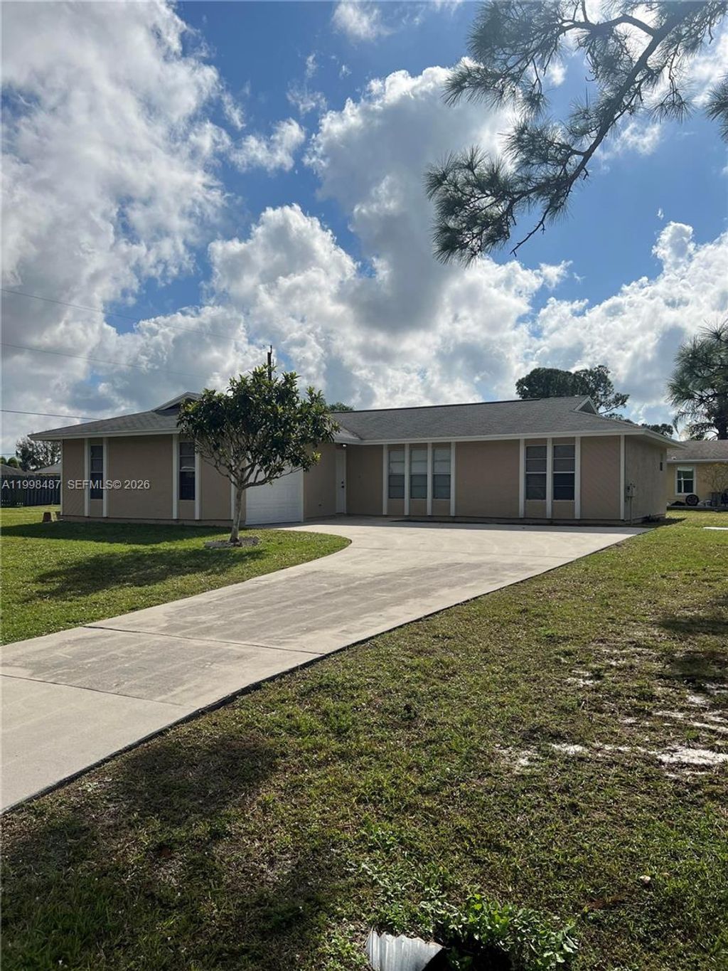 Photo of 592 SW Todd Ave, Port St Lucie, FL 34983 (MLS # A11998487)
