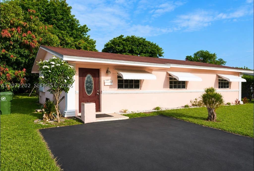 Photo of 2221 NW 30th Way, Fort Lauderdale, FL 33311 (MLS # A12072202)