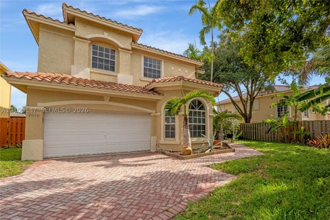 Photo of 2010 NW 98th Way, Pembroke Pines, FL 33024 (MLS # A12100147)