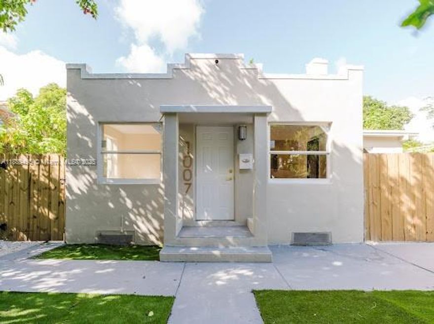 Impeccably updated 3 bedroom 2 bathroom new designer single family home. 2 additional extra rooms outside. Outside grill area and covered patio perfect for indoor outdoor living. Completely remodeled and upgraded all with permits. Roof is 2 years new, new impact windows and doors. New kitchen and bathroom. Brand new mechanicals, tankless water heater and electric heating/cooling. New porcelain tile throughout. Maintenance free landscaping. Mature fruitful Mango tree and beautiful Seiba trees. Security system and outdoor cameras included. American home sheild Home Warranty Gold plan included with coverage for the following items: heating, cooling, electrical, plumbing, kitchen and laundry appliances. Will be ready to go with reoccupancy asap!