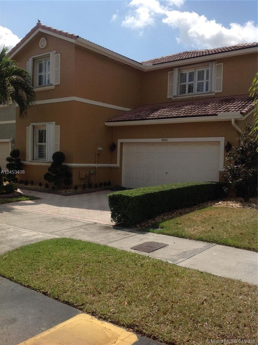 A true one of a kind! A Gem! To many extras to mention, A MUST SEE. Move in ready with a beautiful wood kitchen topped off with a Silestone Top.  No expense spared on Travertine floors, Plantation Shutters throughout the home and Hurricane Accordion Shutters as well. Beautiful lighting fixtures, crown molding. All this in a wonderful community.