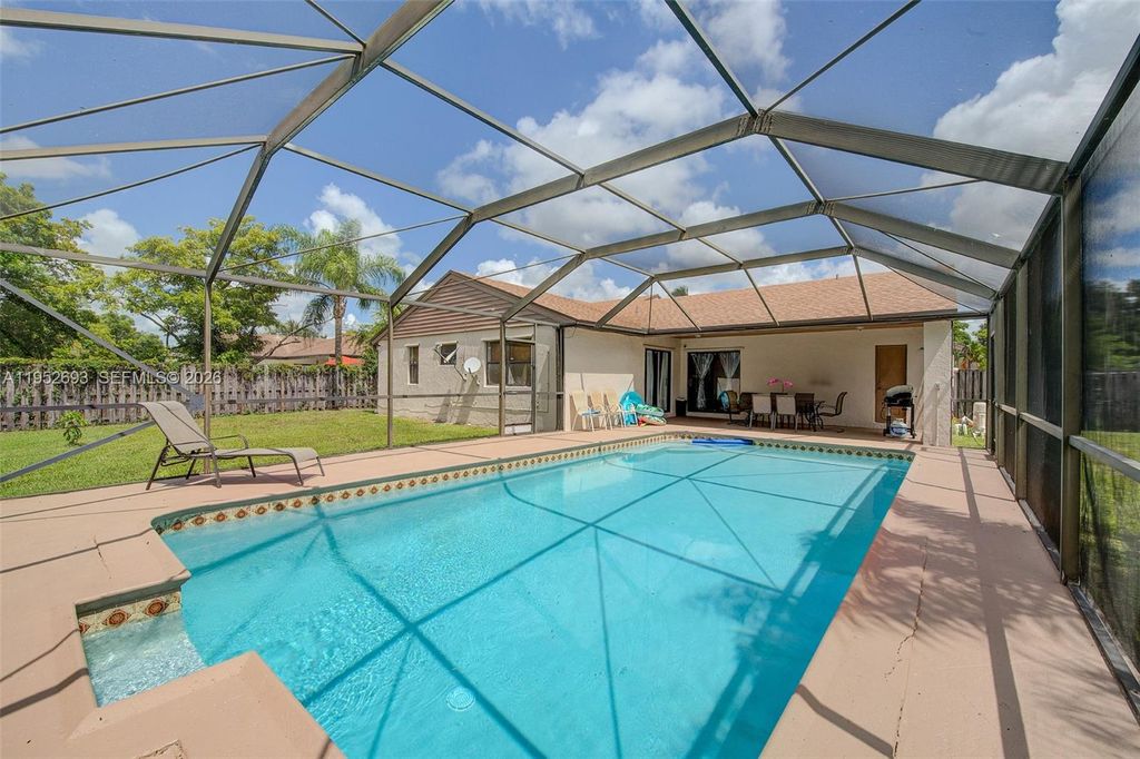 Photo of 11909 SW 48th Ct, Cooper City, FL 33330 (MLS # A11952693)