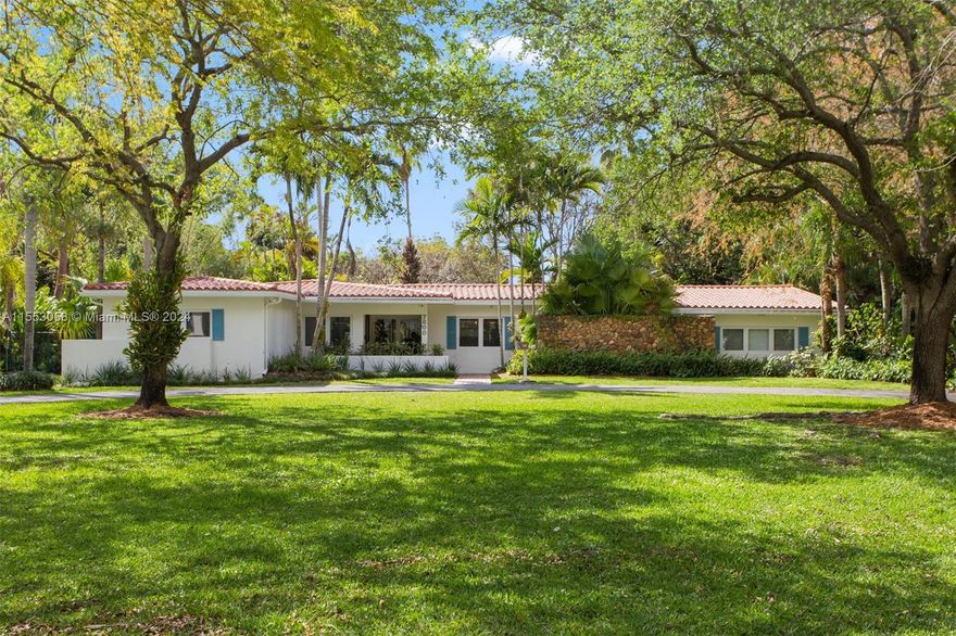 Charming 4 Bed + Office / 2 Bath Home on a Tropical Acre of land in Pinecrest! Your grand driveway entrance leads up to the home. Enter your home to spacious entertaining spaces with views of your pool & deep acre lot. Split floor plan with 3 large secondary bedrooms on one side. Primary Suite on the west side of the home with a walk in closet & large renovated bathroom. Backyard has a sizable covered patio by the pool and plenty of yard space. Home features impact windows and doors, beautiful wood floors, 2 car garage, and more. Endless possibilities exist on this deep and lush 41,817 SF Lot! Pinecrest is renowned for its excellent schools, parks & gardens, making it the perfect place for families. It's not Miami, it's Pinecrest!