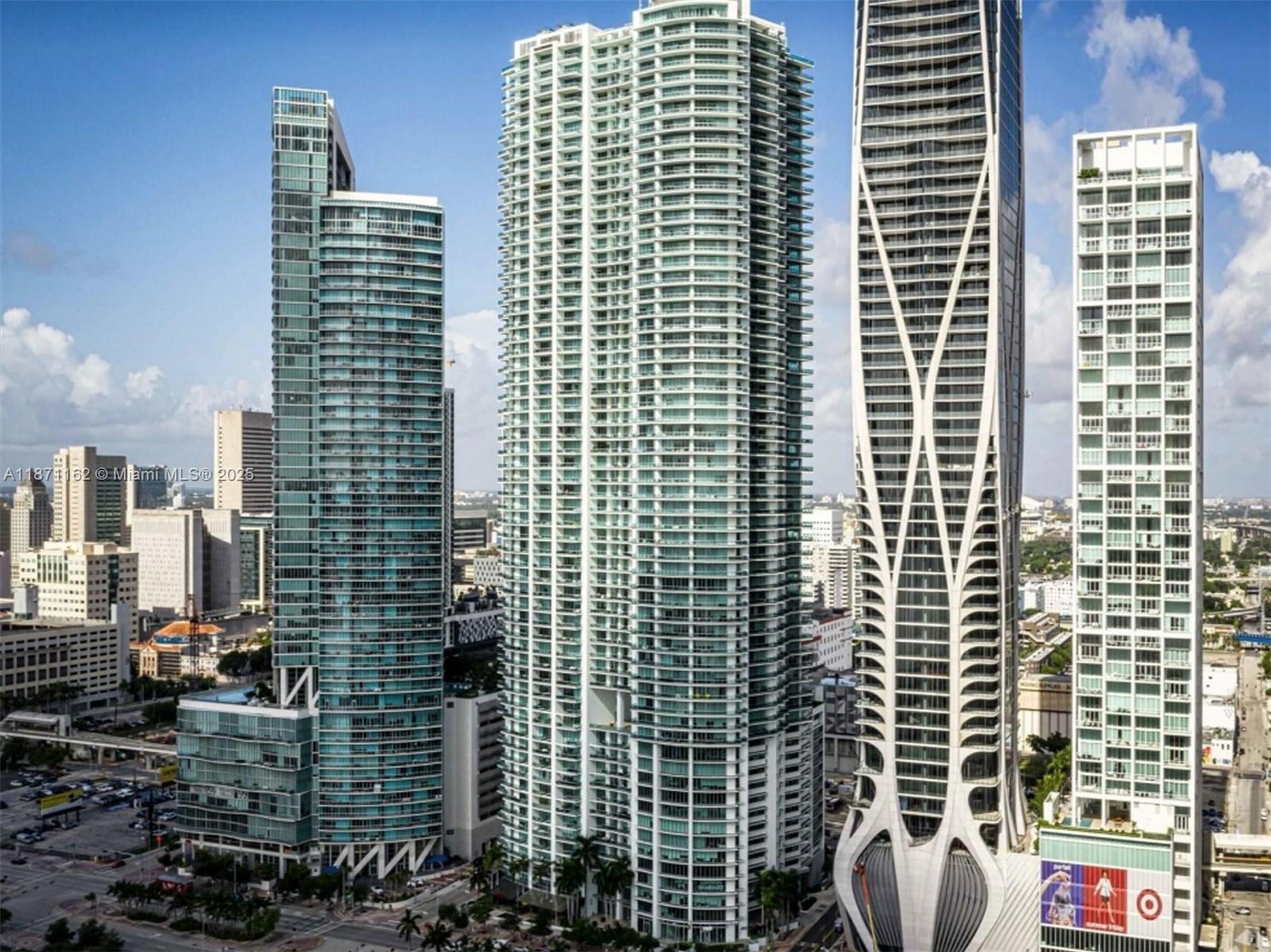 Turnkey office with panoramic views of Biscayne Bay and Downtown! Take your business to the next level in this 1,910 SF fully furnished office at the prestigious 900 Biscayne Bay Miami Building, located on the 14th floor with panoramic views of City of Miami. Features: private offices, reception, conference & storage rooms, kitchen, built-ins throughout, move-in ready with desks, computers, phones, hurricane impact windows, monthly valet parking up to 3 vehicles, close proximity from New Design District, Miami Beach, The Perez Museum, I-95. A rare opportunity across from the Kaseya Center, minutes from Brickell, Wynwood, and the Design District. Owner's Financing available. Also for Lease, please refer to Broker's remarks.